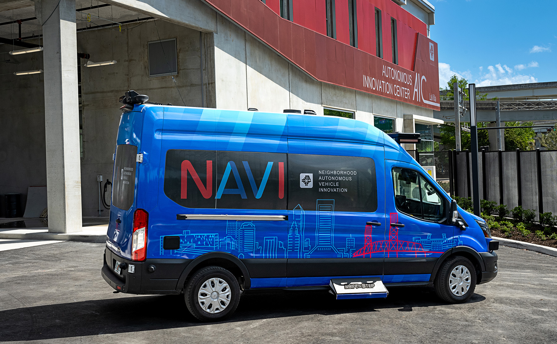 NAVI Vehicle in front of the AIC building